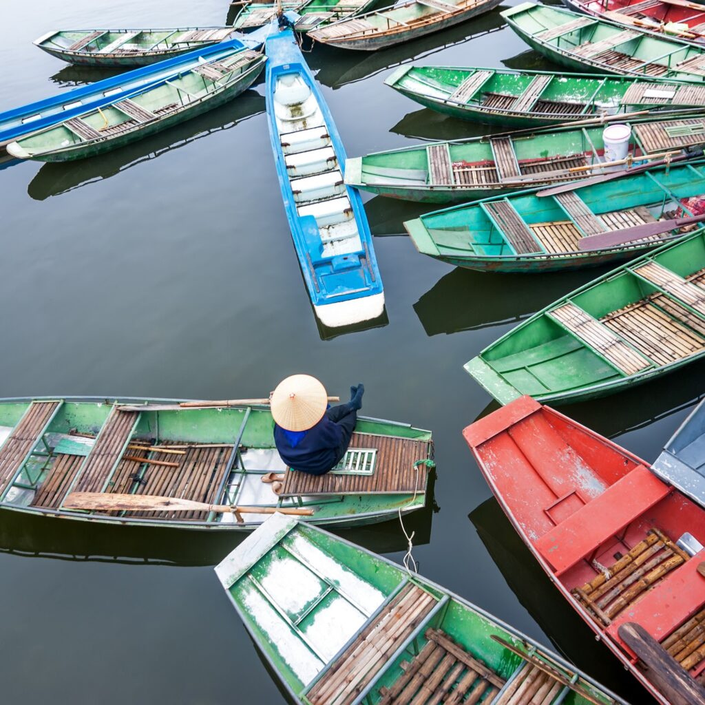 Vietnamese boats at river. Ninh Binh,. Vietnam